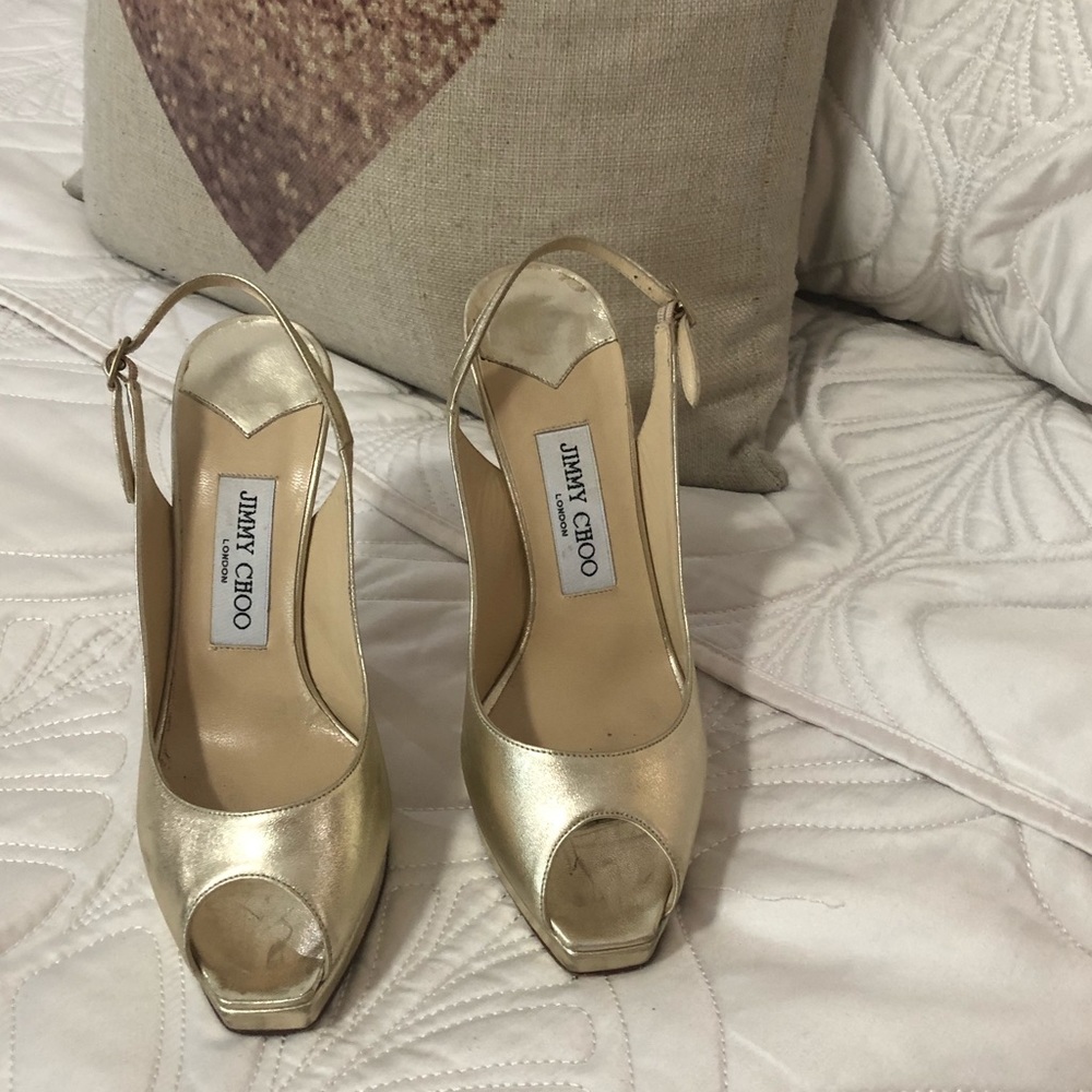 Jimmy Choo gold heel.